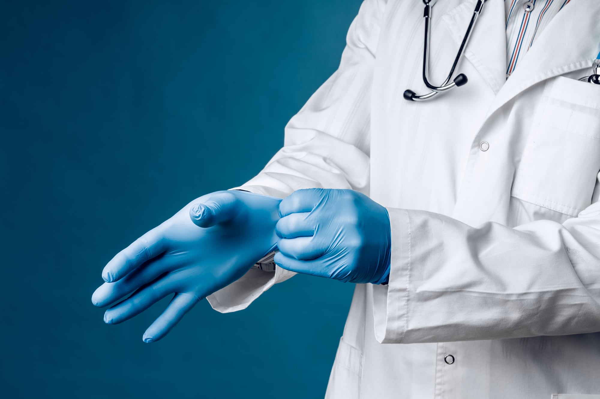 Medical professional wearing protective gloves